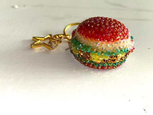 Colorful rhinestone keychain with a gold star charm on a white background