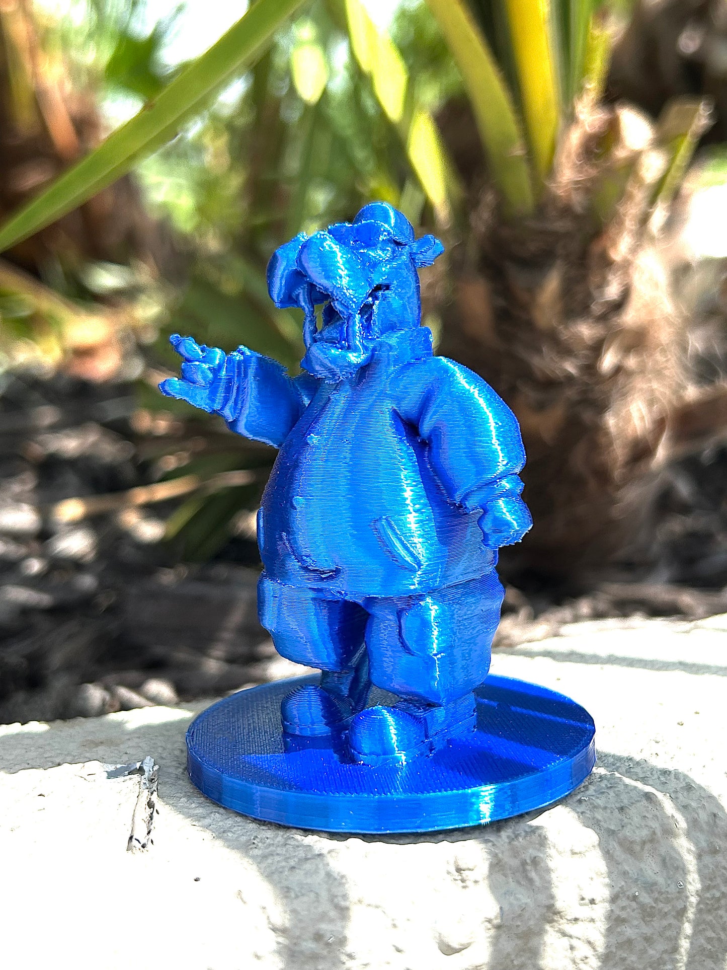 Blue McHippo 3D modeled figurine in forest background