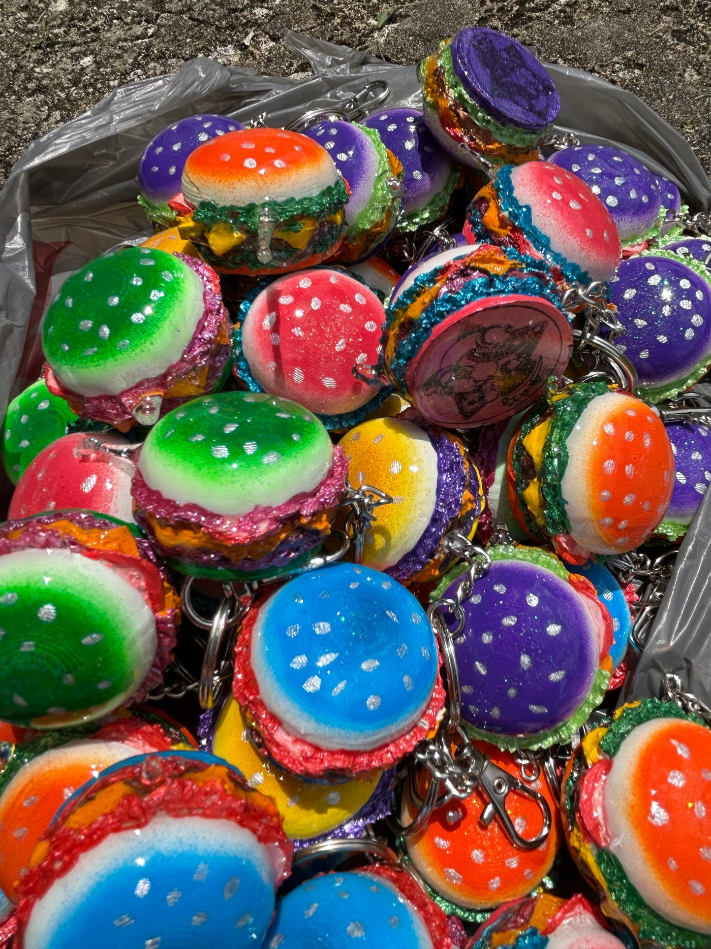 Colorful burger keychains in a clear bag