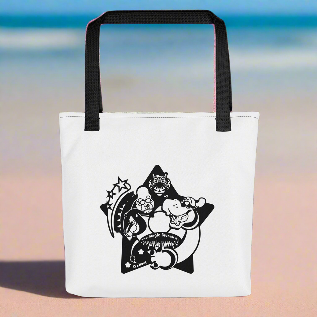 White tote bag with black star design featuring cartoon characters on a beach background