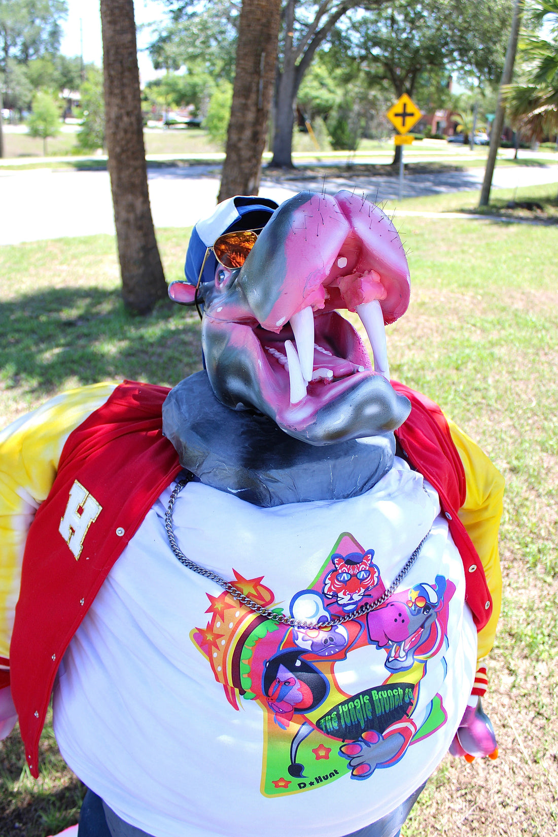 An animatronic of McHippo on a nature/street background