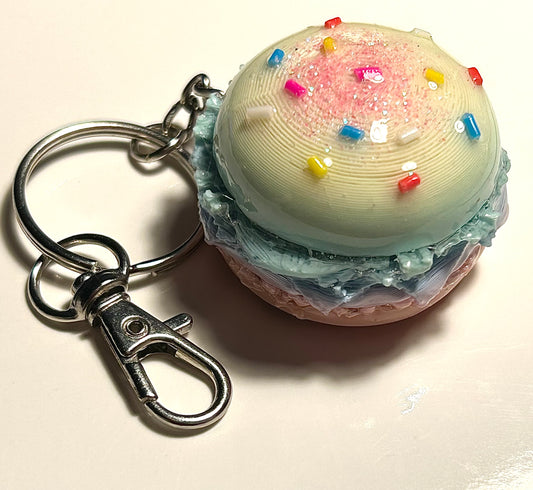 Yellow pastel burger Keychain with a colorful sprinkles with spherical design on a white background