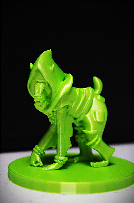 Green mandrill 3D modeled figurine against black background