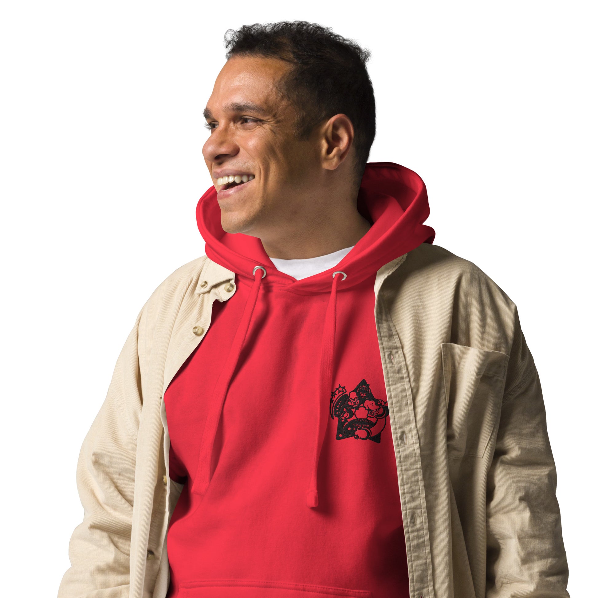 Man wearing a red hoodie with a logo and a beige jacket on a white background