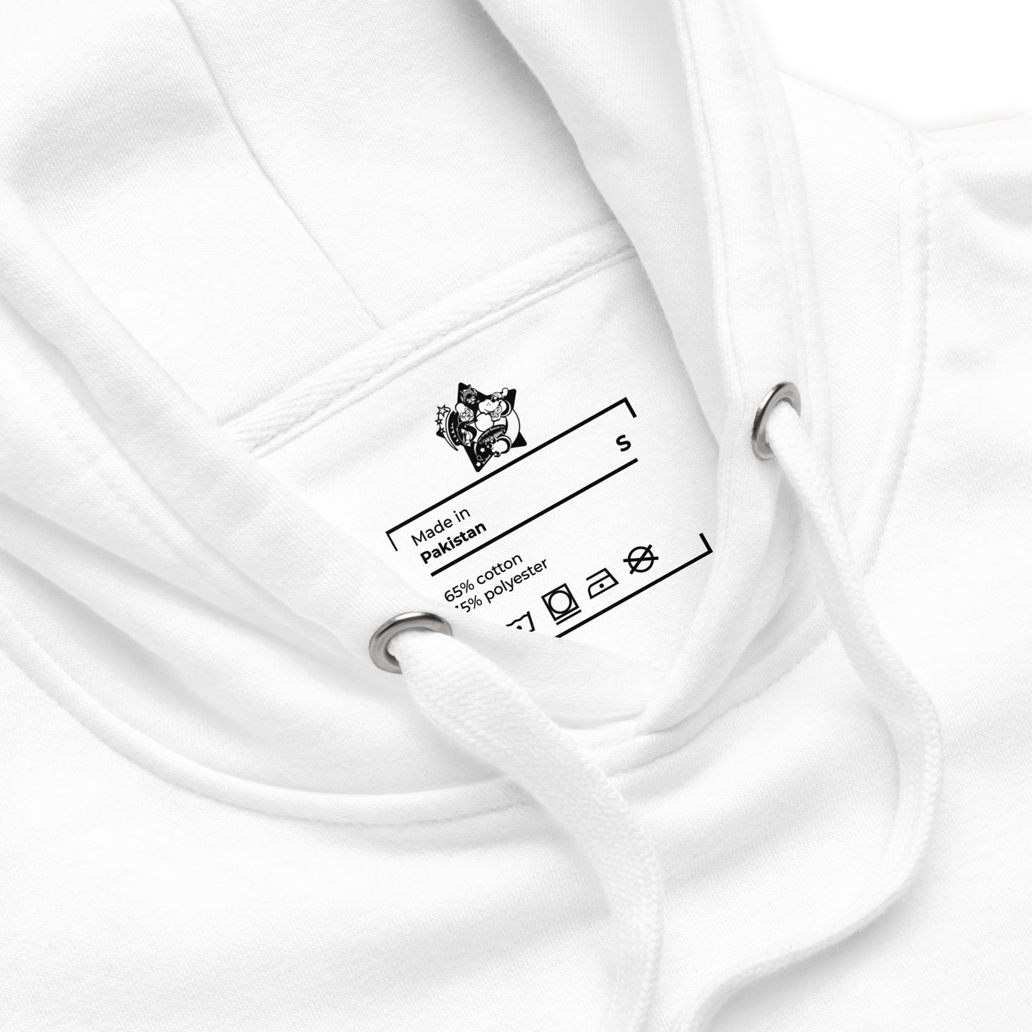 Close-up of a white garment with a label on a white background