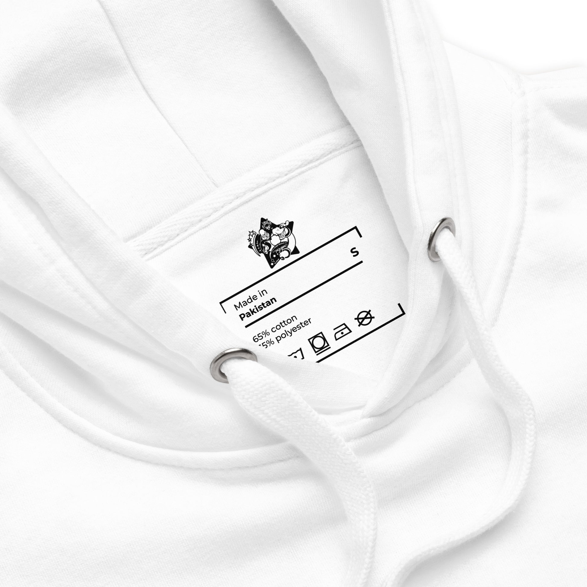 Close-up of a white garment with a label on a white background