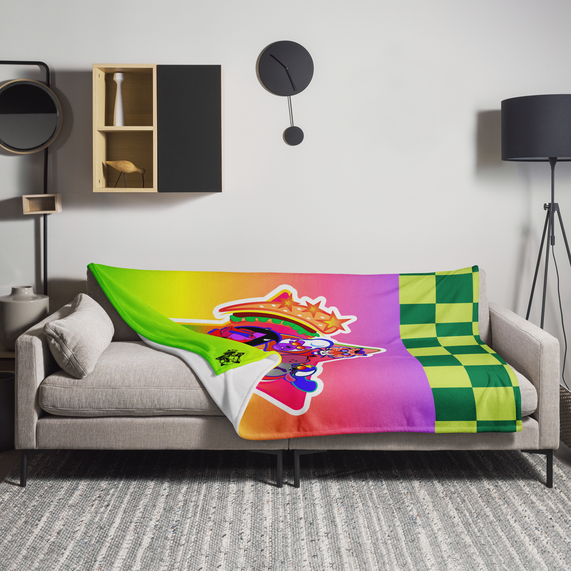Colorful blanket with a graphic design on a gray sofa in a living room.