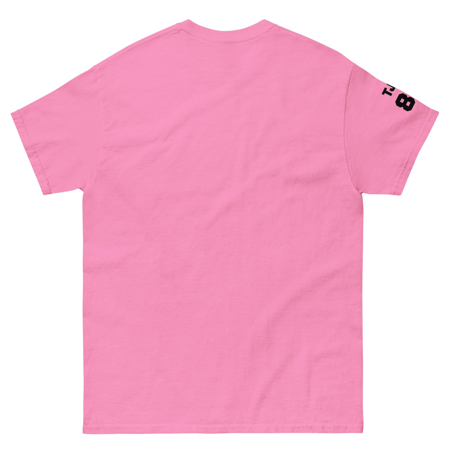 Pink t-shirt with a small black logo on the sleeve against a white background
