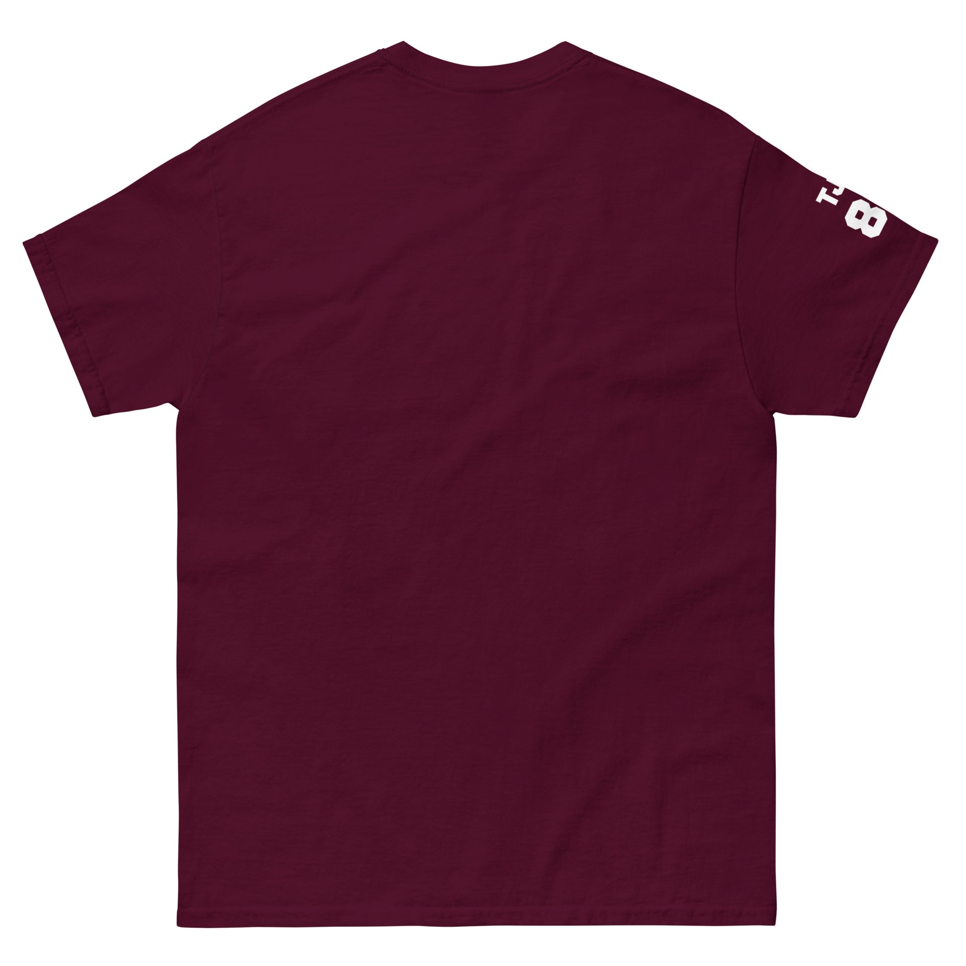 Maroon t-shirt with a small white logo on the sleeve against a white background