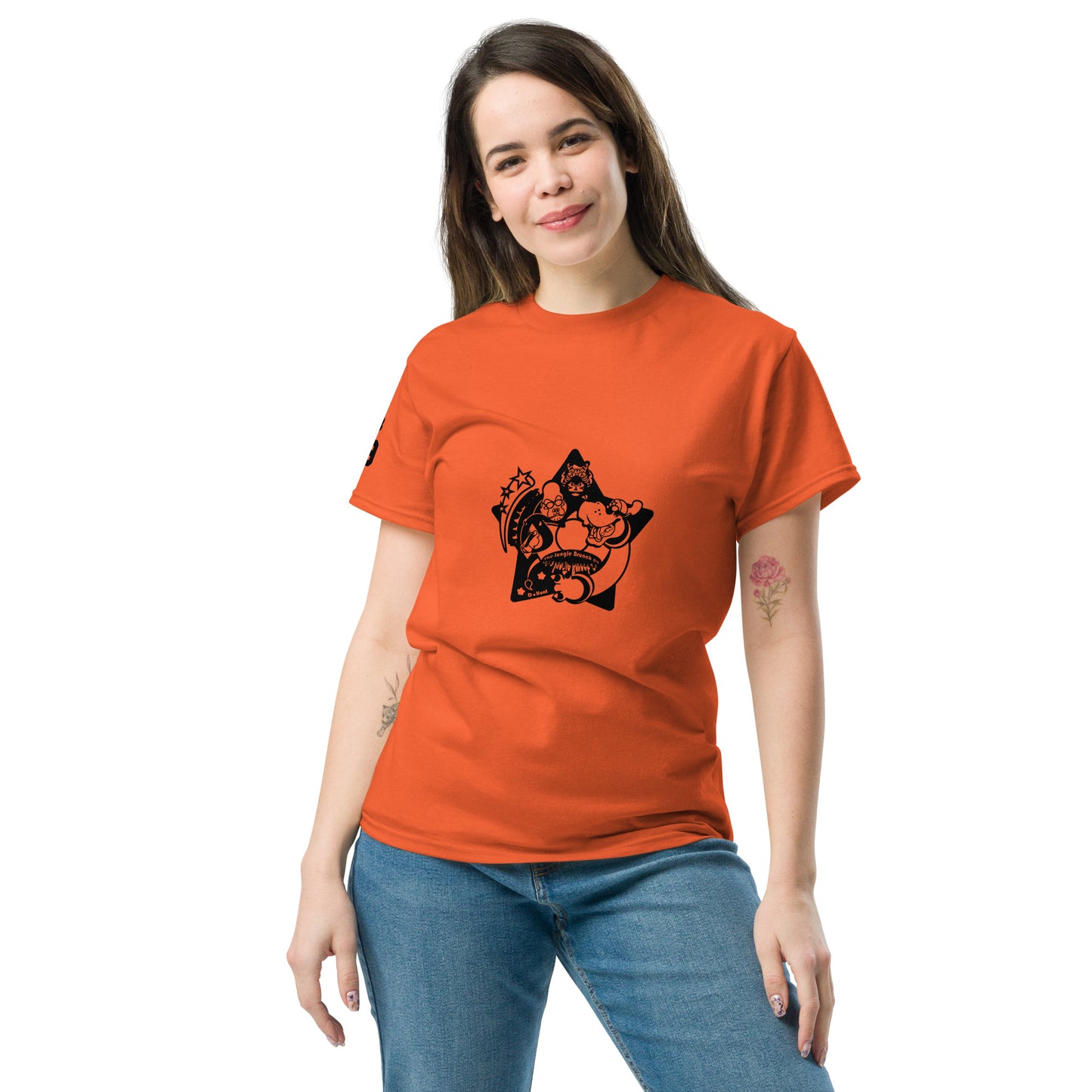 Woman wearing an orange t-shirt with a black graphic design on a white background